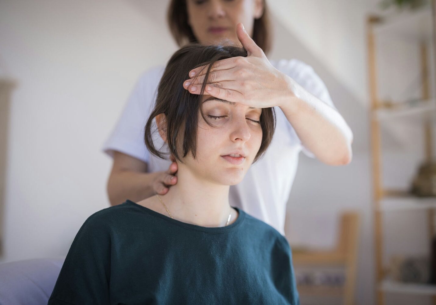 Healthcare professional assessing a patient with post-accident headache and concussion-like symptoms.